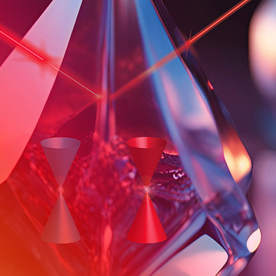 Red laser refracting through a crystal