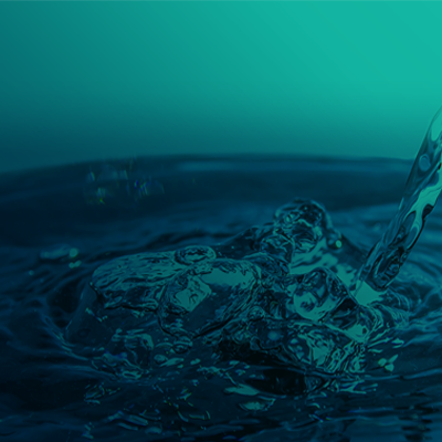 Close up view of pouring water with a blue background