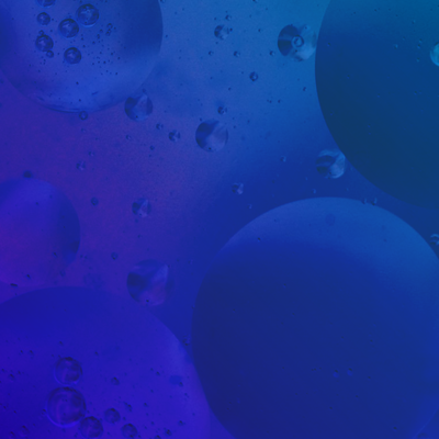 Abstract purple/blue view of molecules suspended in water.